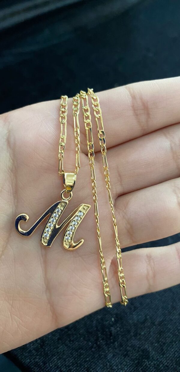 Inicial cursiva oro laminado