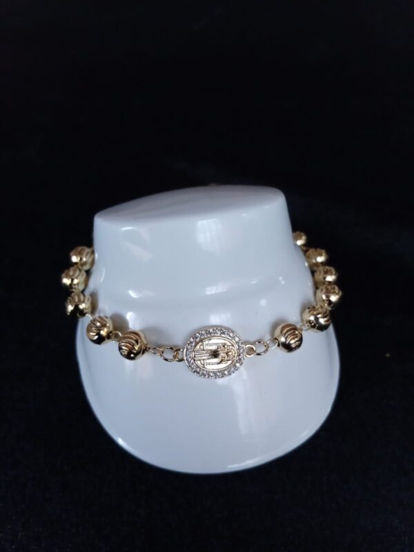 Pulsera religiosa  oro laminado