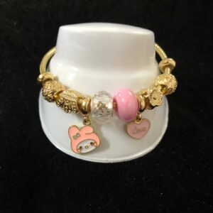 Pulsera ajustable con dijes oro laminado