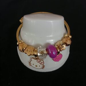 Pulsera ajustable con dijes oro laminado
